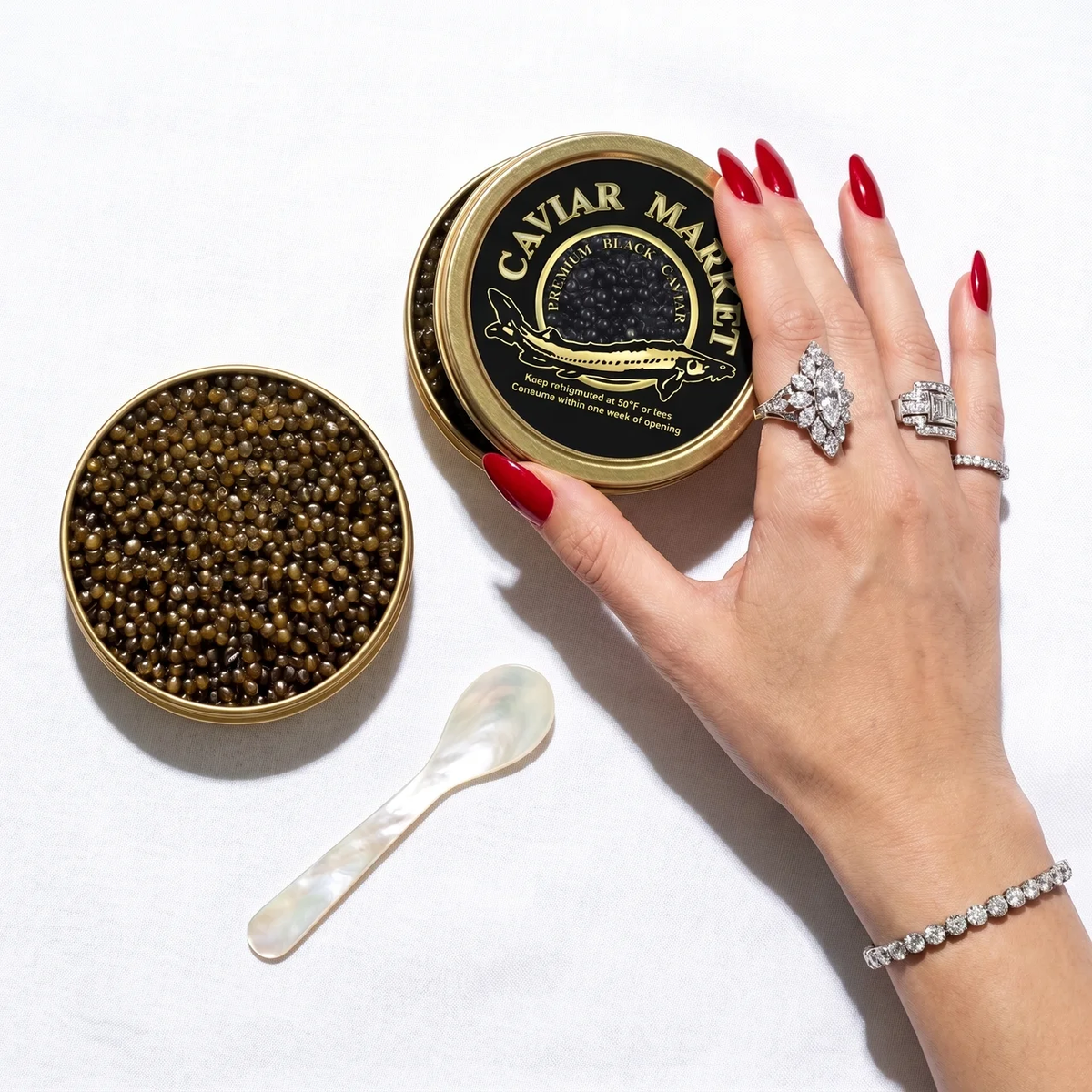 Kaluga Queen premium black caviar tin with mother of pearl spoon